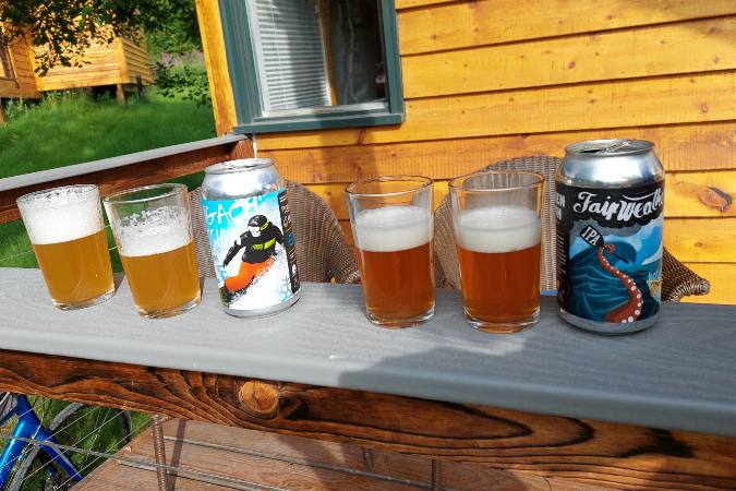 sampling Alaska craft beers on lodge porch
