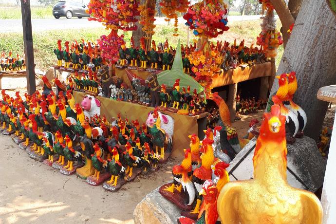 chicken statues donated to roadside shrine