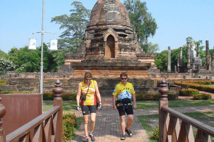 bicyclists walking out of temple area