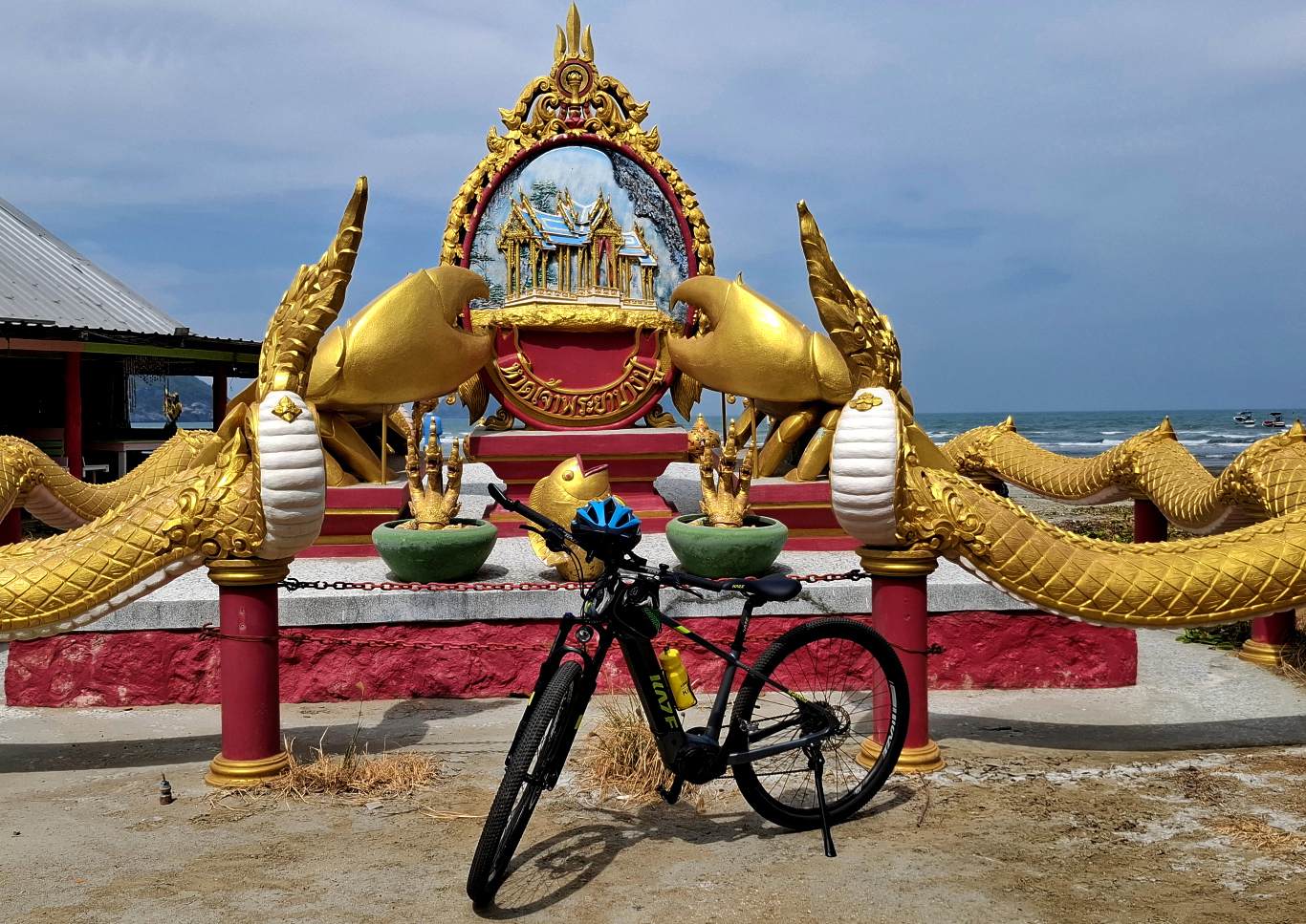 ebike parked in front of crab statue