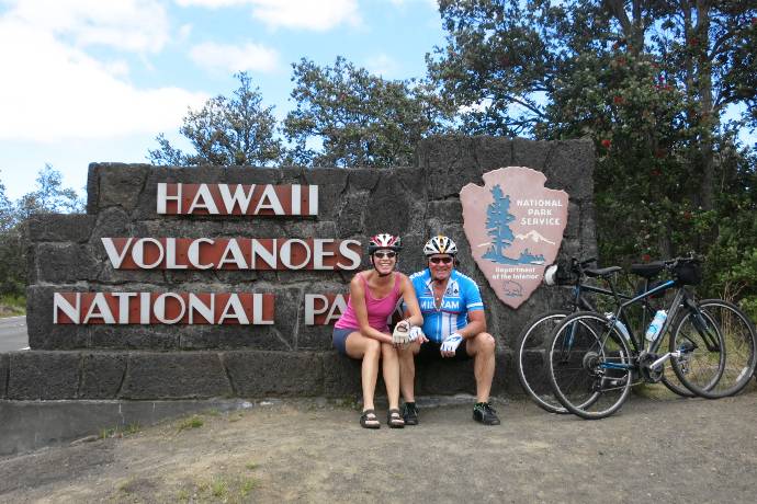 cyclists at entrance to Volcano National Park