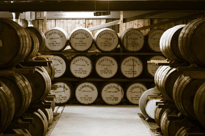 whisky aging barrels in basement