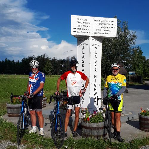 Bicycling tours in North America cyclists at Mile 1422 of the Alaska Highway