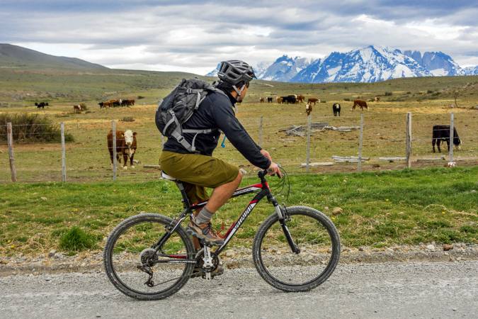 bicyclist in road in Torres Del Paine park