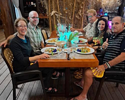 group at dinner on Moorea