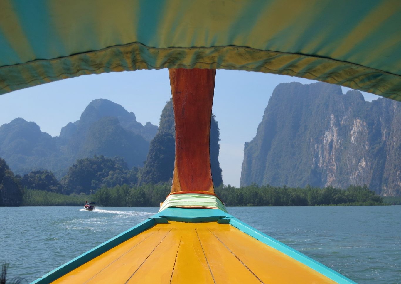 Longtail boat on Chiew Larn Lake in karst scenery
