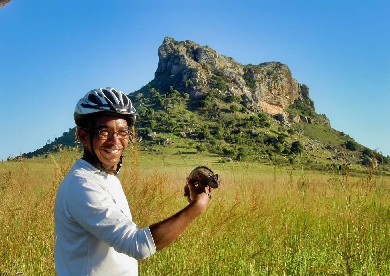 Bicyclist holding a chameleon