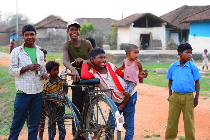 children and their bike in ethnic village