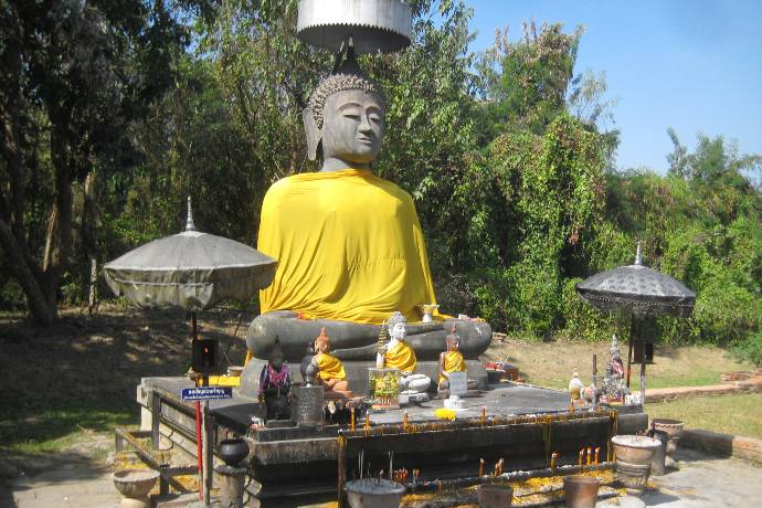 Buddha image dressed in winter robes