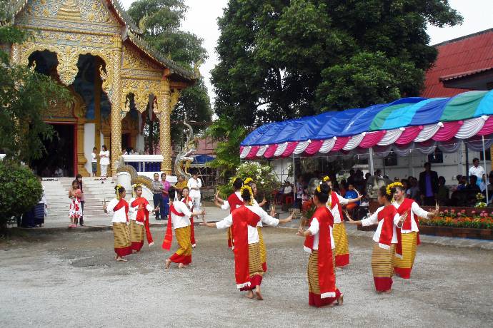 dancers in traditional clothes at temple