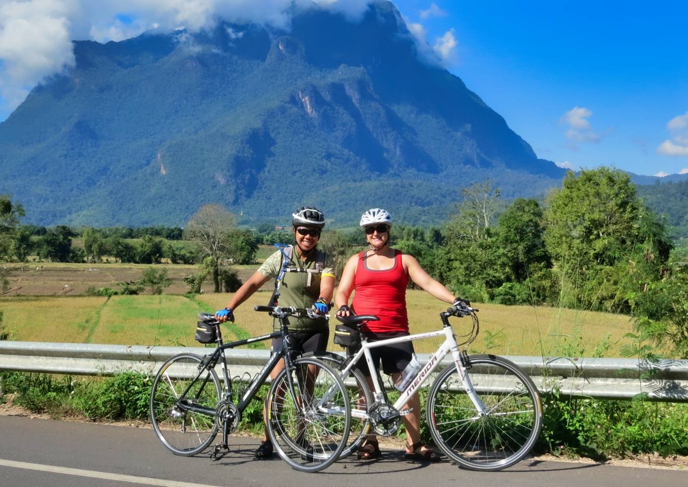 two cyclists in front of Chiang Dao mountain