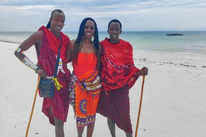 guest on beach with Maasai